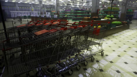 shopping carts lined up in a modern grocery store at night