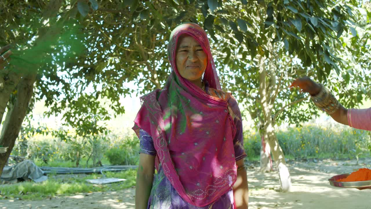 Multi ethnic people celebrating the festival of colors Holi in India