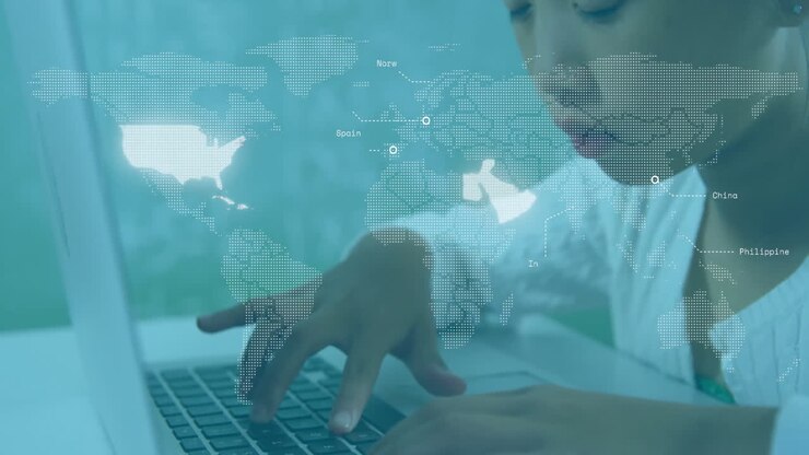 In school, child typing on laptop with animation of digital world map overlay