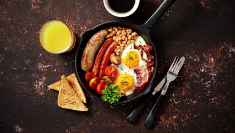 delicious english breakfast in iron cooking pan