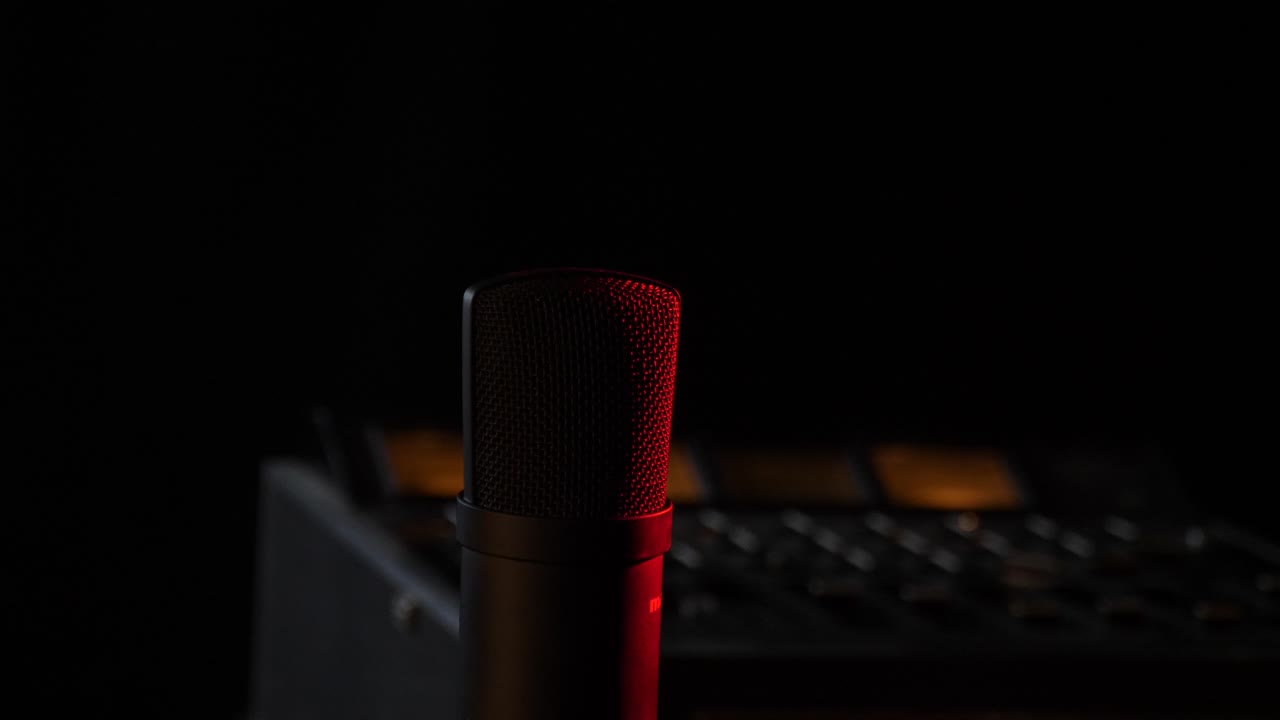 Microphone in the studio on the air with a mixing board