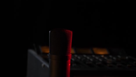 microphone in the studio on the air with a mixing board