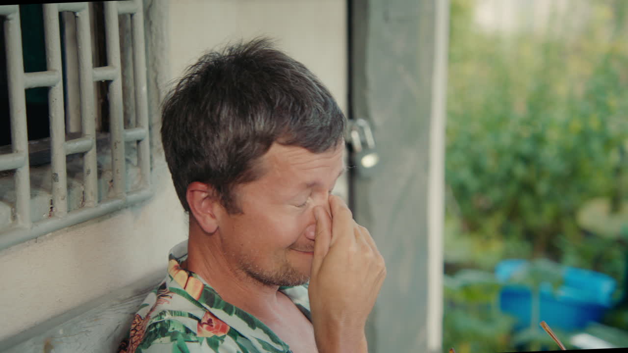 Man with sad expression outdoors