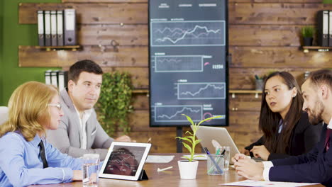 Middle-age-businesswoman-having-a-meeting-with-his-financial-team