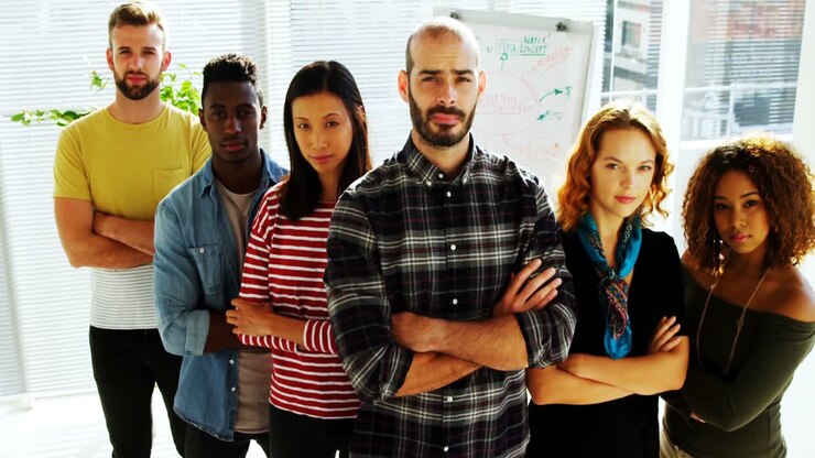 Group of colleagues standing with arms crossed