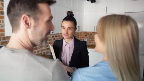 Video-of-real-estate-agent-talking-to-a-couple-of-clients