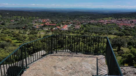 drone flight in a viewpoint where from the hallway to the platform with a camera elevation we see the toledo plain, a rural town called pelahustan with an environment of holm oaks, toledo, spain