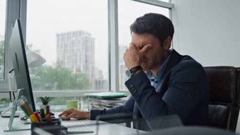 upset manager analyzing data thinking financial company problems at workplace.