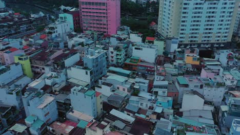 Early-morning-drone-fly-in-over-modern-urban-rooftops-towards-illuminated-French-colonial-Catholic-Church