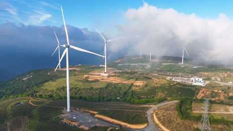 Wind power turbines on high hills in Vietnam at sunrise - Wind power