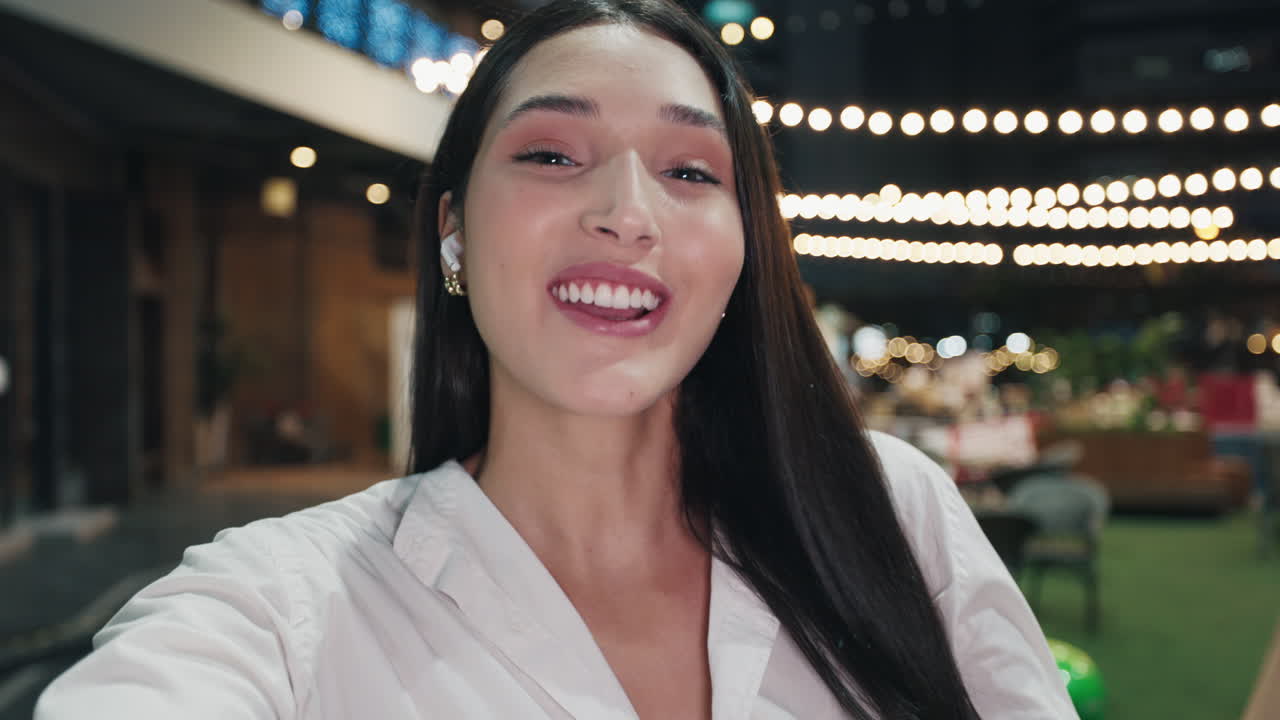 Woman Taking Selfie at Night Event