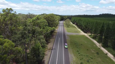 aerial view of a quiet national highway and forest both side of the road