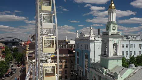 cityscape with ferris wheel and clock tower