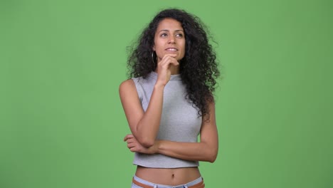 young beautiful hispanic woman thinking