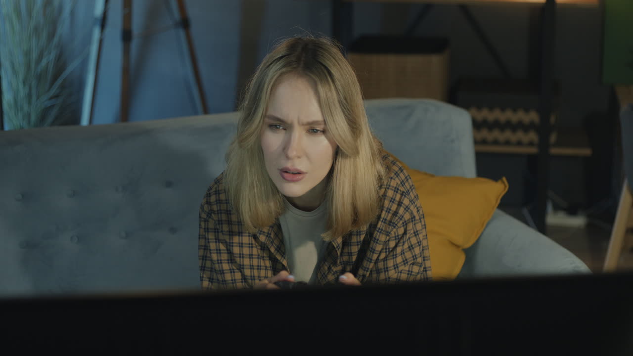 Woman Playing Video Games on Couch