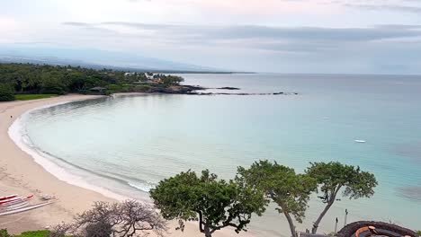 Waves-washing-in-Kauna'oa-Bay-and-beach-on-the-Big-Island-of-Hawaii-at-sunset---wide-angle-time-lapse