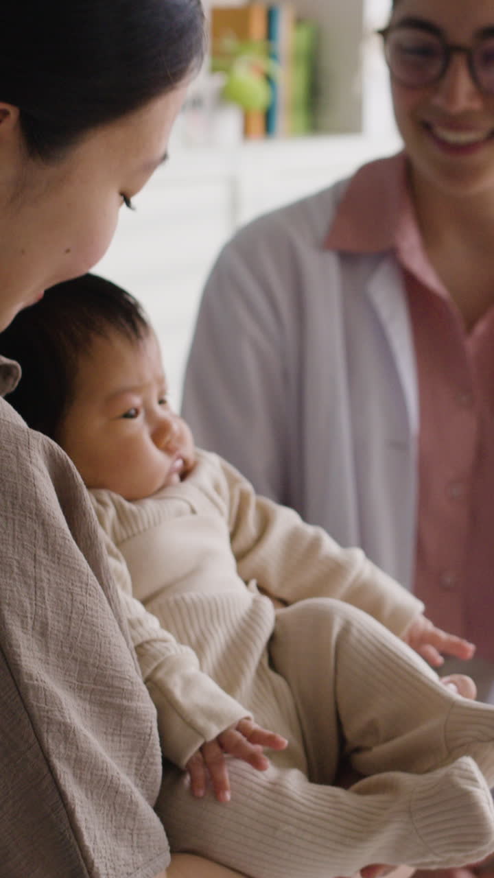 Mother and baby with doctor
