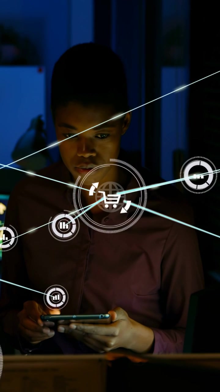 Vertical video: Man tapping smartphone at desk, colleague joining, HUD cart linking nodes for sales