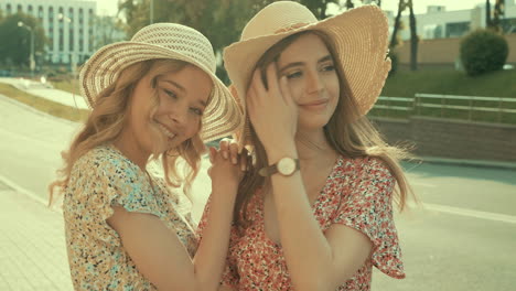 two women friends enjoying summer in the city