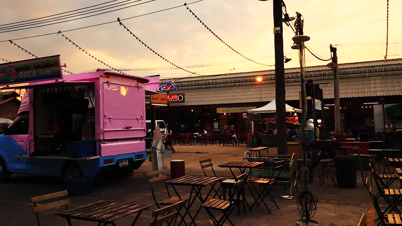 Editorial use only. Panning shot of Talad Rot Fai Srinakarin, also known as Train Market, a massive open-air vintage themed night market in Bangkok, Thailand