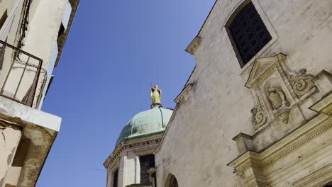 roofs of a city in france abt with richenkuppe on which a statue sits