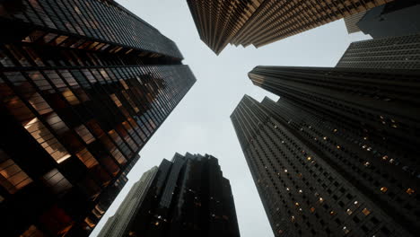 looking directly up at the skyline of the financial district