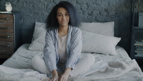 woman sitting comfortably in bed