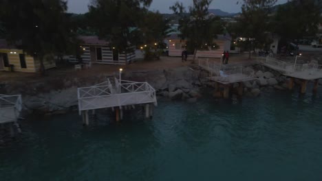 drone view of seafront restaurants in marina island, malaysia