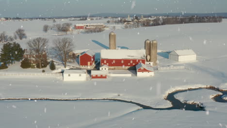 Winter-snow-with-red-barn-farm-buildings