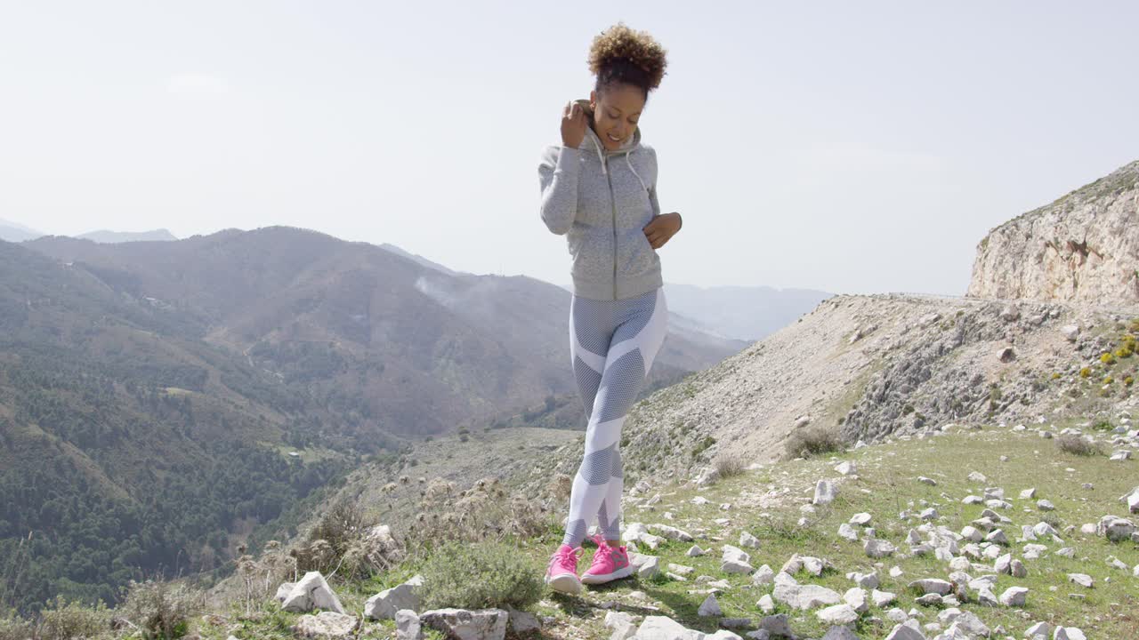 Young beautiful woman in sportswear posing