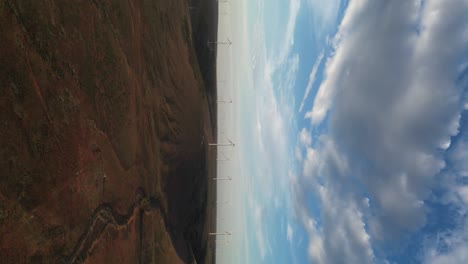 Vertical-drone-shot-of-wind-farm-with-windmills-in-rural-area-of-Australia