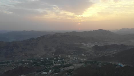 Aerial-view-of-an-amazing-endless-mountain-landscape-sunrise