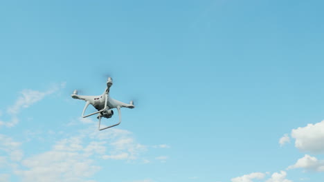 helicopter against the blue sky with white clouds