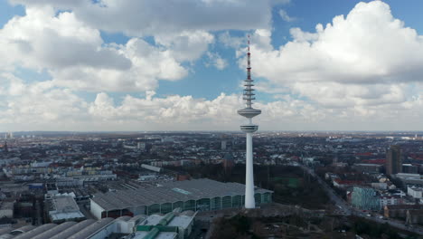 Close-up-aerial-dolly-view-of-Heinrich-Hertz-TV-Tower-above-Hamburg-urban-city-center