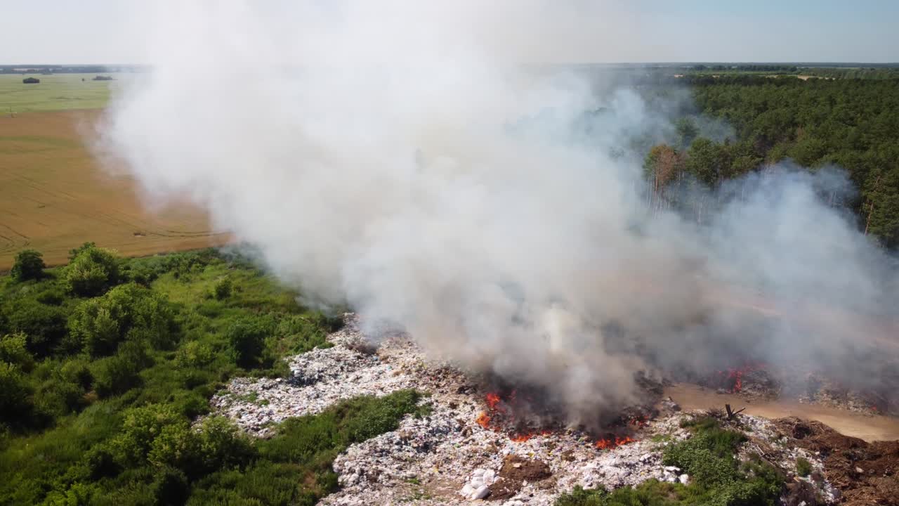 Flying around garbage dump site in fire