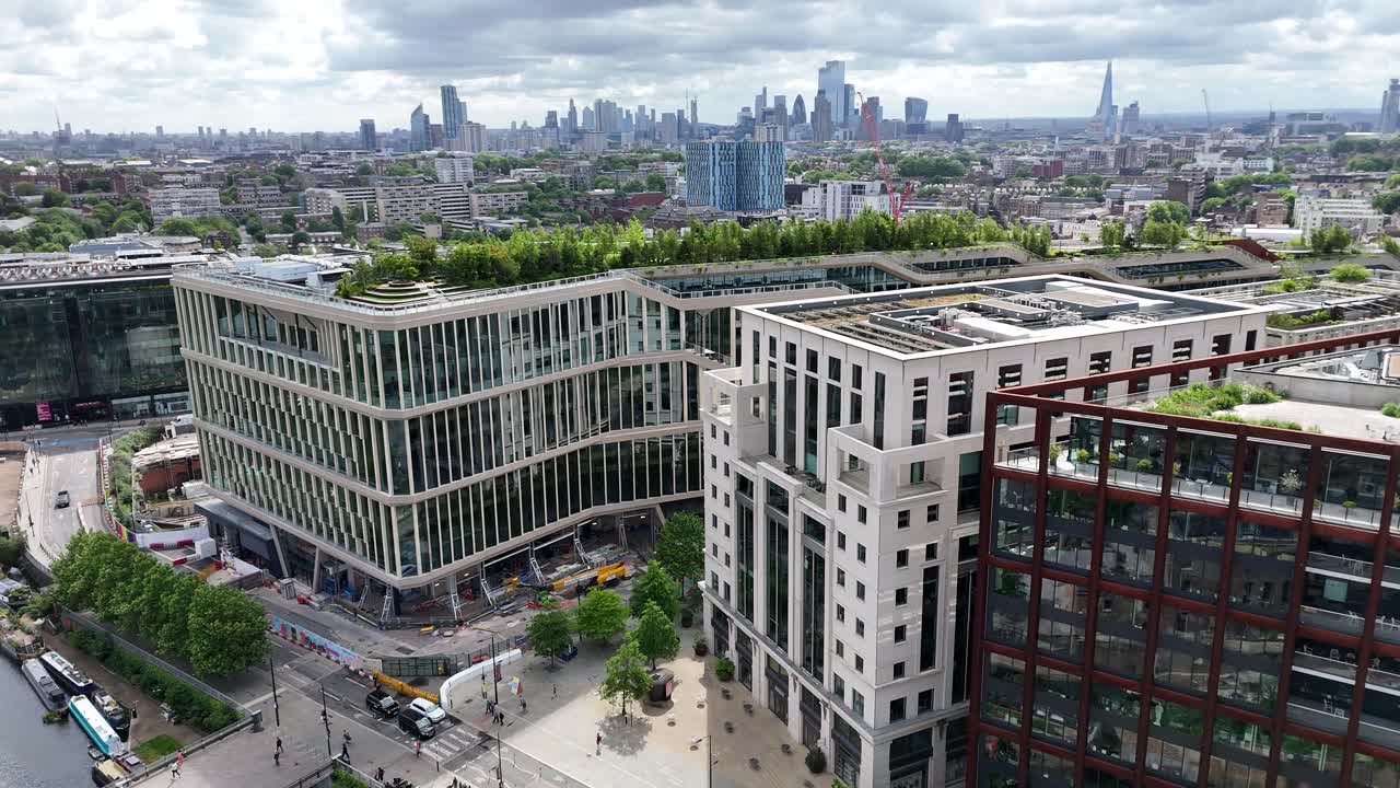 Aerial views of Coal Drops Yard, King's Cross Station, Rooftop Gardens and City Skyline. London’s dynamic blend of heritage and modern architecture.