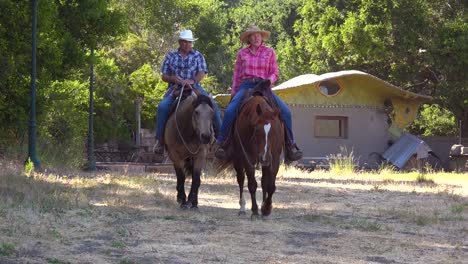 a retired couple enjoys retirement riding horses horseback on a ranch in santa barbara california