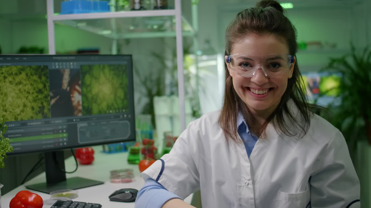 Portrait of biologist woman putting medical glasses looking into camera