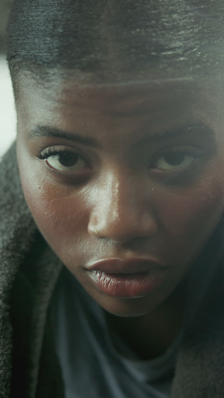 Intense Close Up of a Young Black Woman's Sweaty Face
