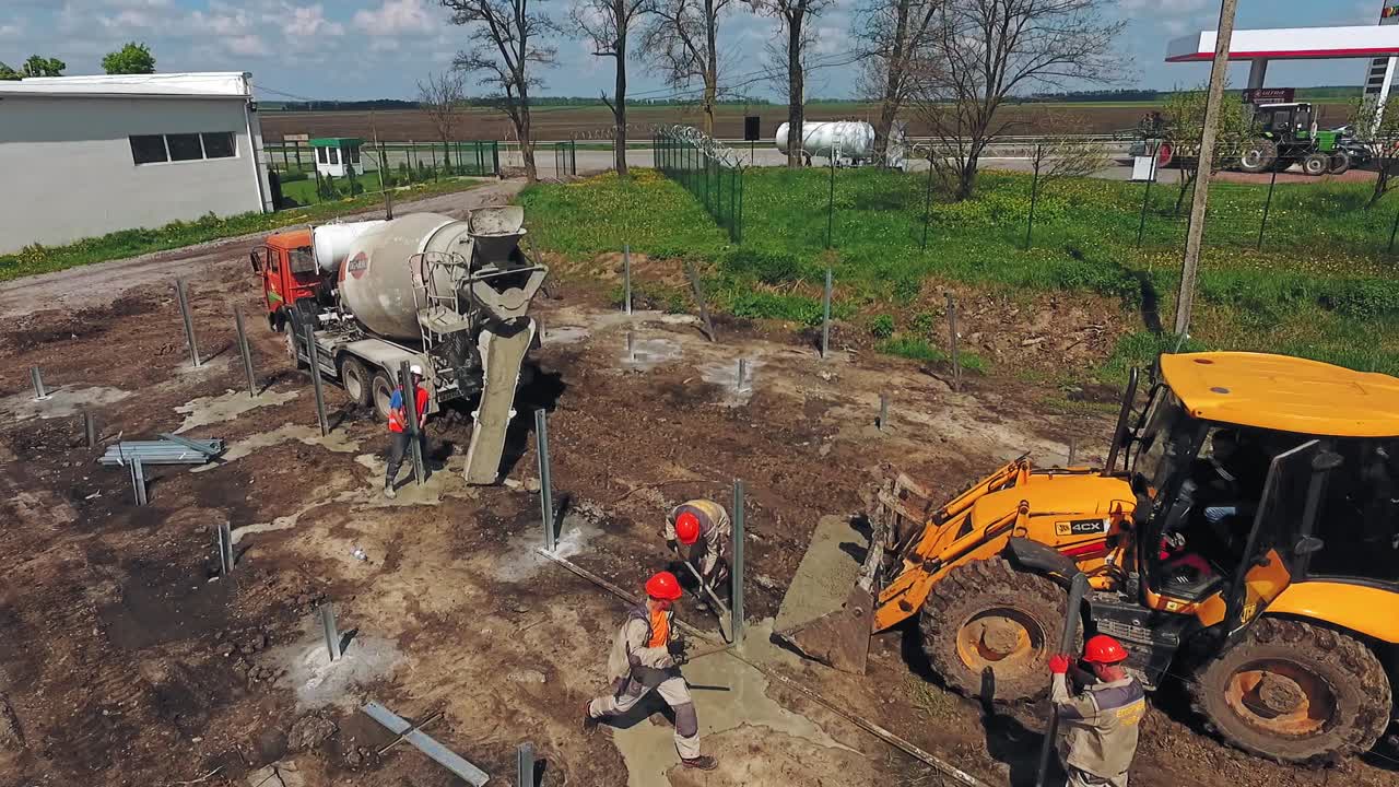 Construction site in progress. Aerial view of machine working in construction site