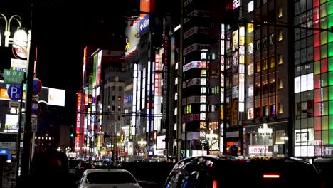 illuminated urban landscape with moving vehicles