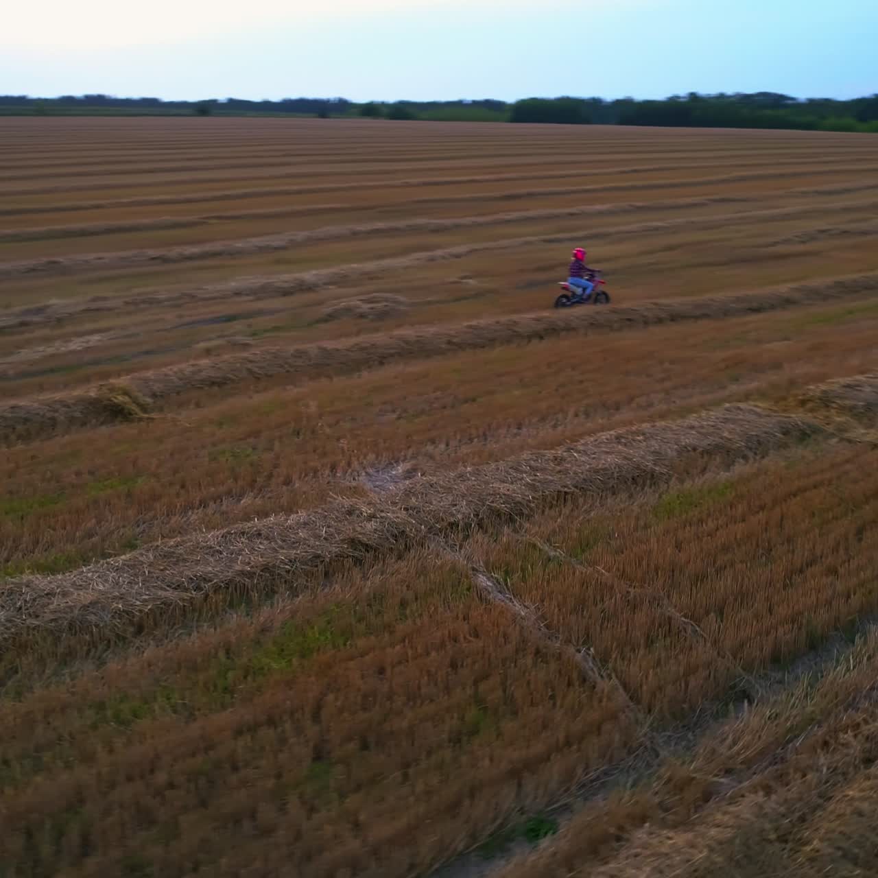 Aerial view of motocrossing landscapes. Motorcycle drivers traveling on a country road