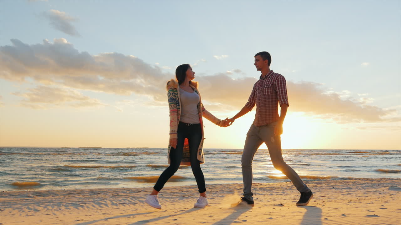 Couple Walking On The Beach At Sunset The Concept - A Happy Honeymoon  Steadicam Slow Motion Shot Free Stock Video Footage Download Clips Family