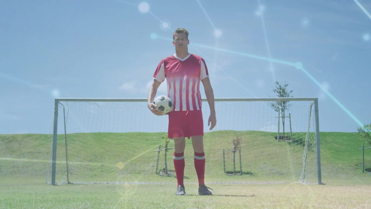 Mannelijke speler stapt het doel in, houdt bal vast, bereidt sportoefening voor, netwerkoverlays drijven.