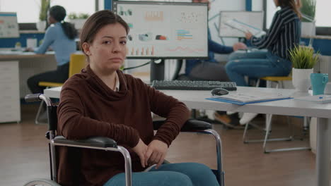 portrait of immobilized paralyzed tired woman looking at camera