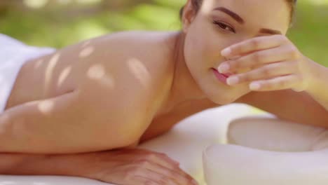 woman looking over in outdoor beauty spa