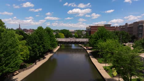 cinematic establishing shot above dupage river in downtown naperville, illinois