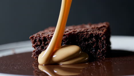decadent chocolate brownie with pouring caramel sauce