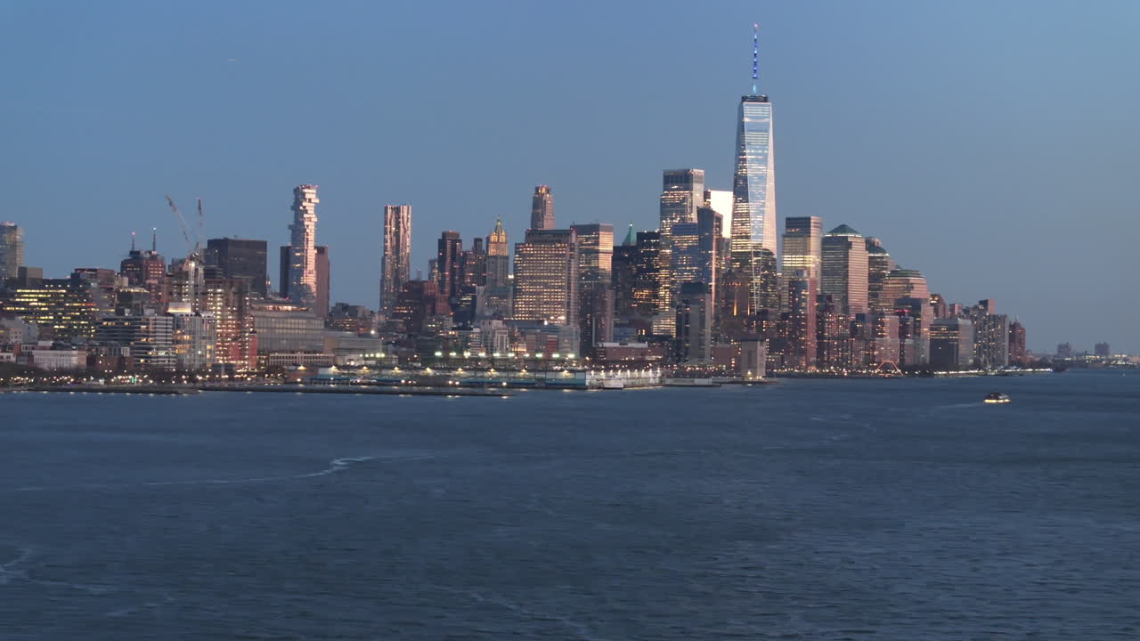 Aerial view of The World Trade Center at night. Shot along The Hudson River in New Jersey.