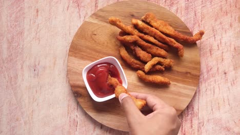 crispy chicken strips with ketchup